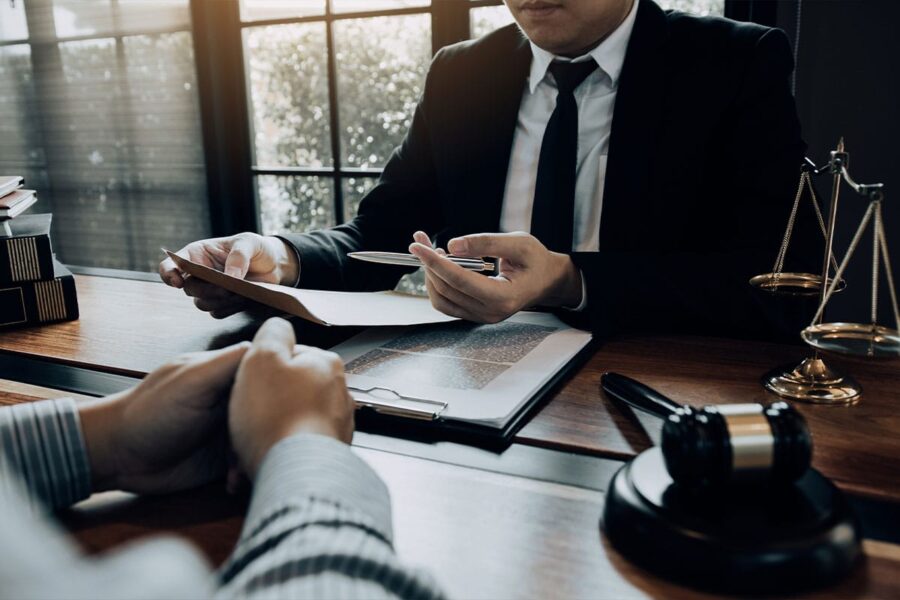a drunk driving defense attorney in San Antonio meeting with a client.