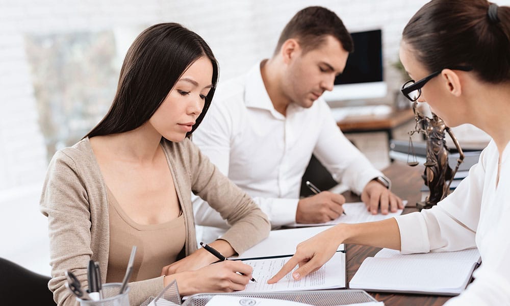 couple meeting with their divorce attorney in San Antonio, TX