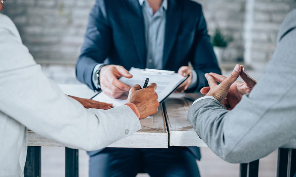 couple meeting with a motor vehicle accident lawyer in San Antonio, TX